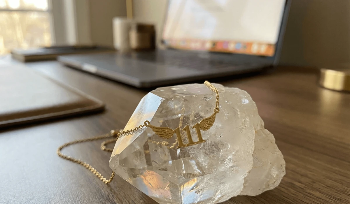 Detailed photo of a gold 111 angel number necklace on a quartz crystal, representing spiritual protection and mindfulness in a digital age.