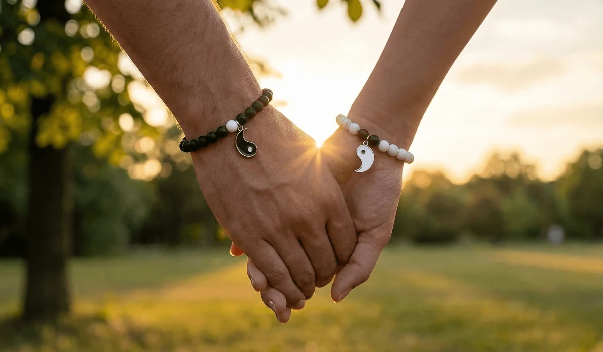 Two people wearing matching Yin Yang couple bracelets to symbolize their connection and mutual support.