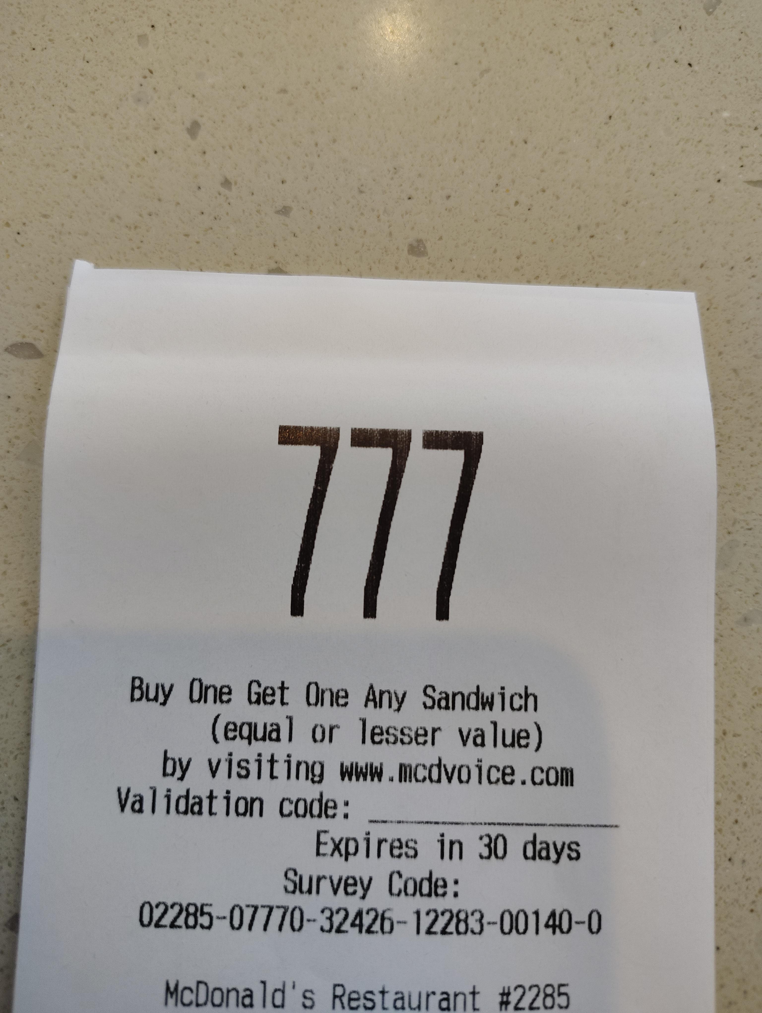 Angel number 777 on a McDonald's receipt