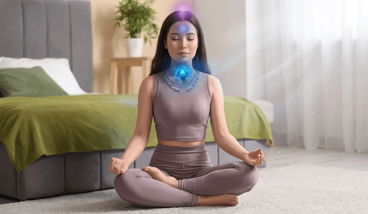A woman meditating with a broken necklace near her throat chakra, representing spiritual symbolism and energy flow.