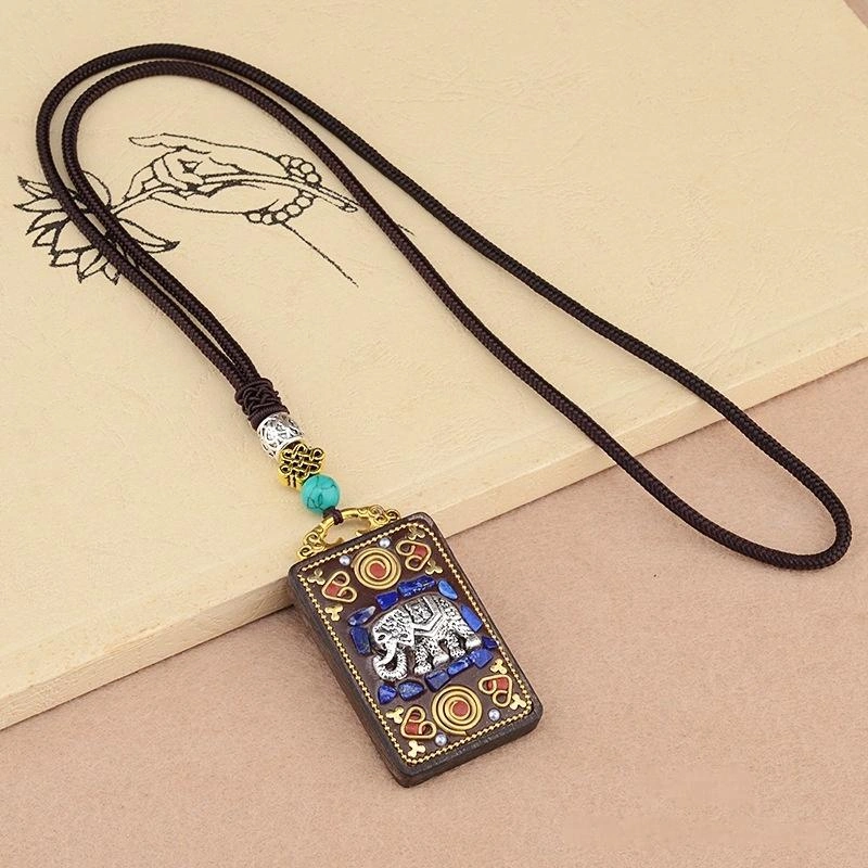 Vintage Ebony Wood Amulet Necklace – 15 Symbolic Designs with Copper Accents & Cotton Cord