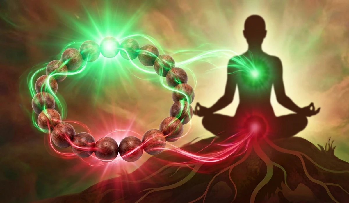 Spiritual illustration of Rosewood beads balancing the Heart and Root chakras with green and red energy flows.