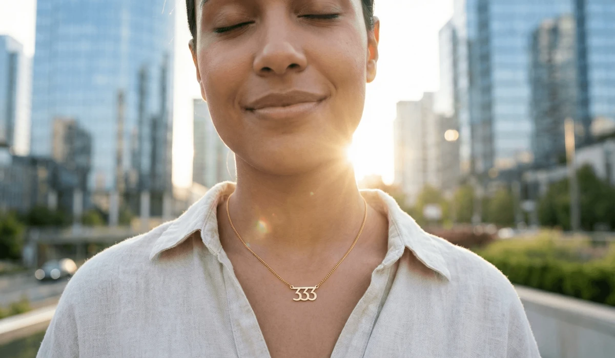 Elegant gold Angel Number 33 necklace worn as a spiritual shield and a symbol of inner peace in a modern world.