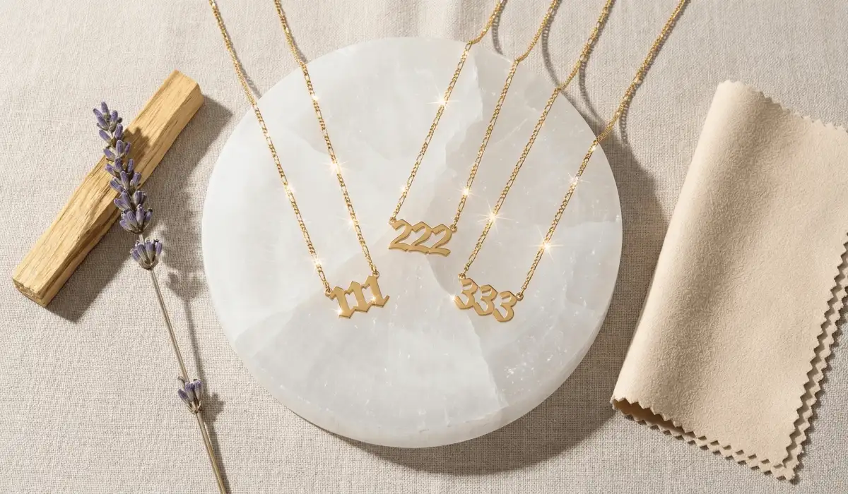 A flat lay of 111, 222, and 333 necklaces on a selenite plate for spiritual cleansing and charging.