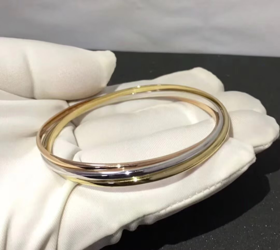 Elegant triple-ring bracelet, unisex design, available in multiple colors.