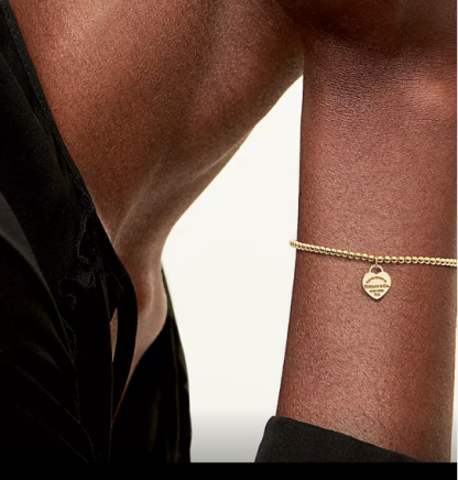 Heart-shaped charm bracelet with decorative trim