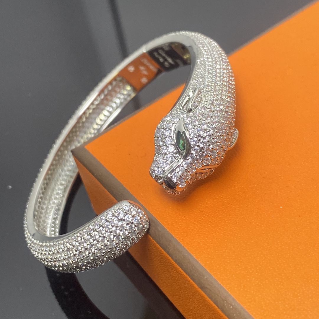 Panthère de Carthttier bracelet, diamond-studded Yellow gold, rose gold, white gold, onyx, emeralds, diamonds