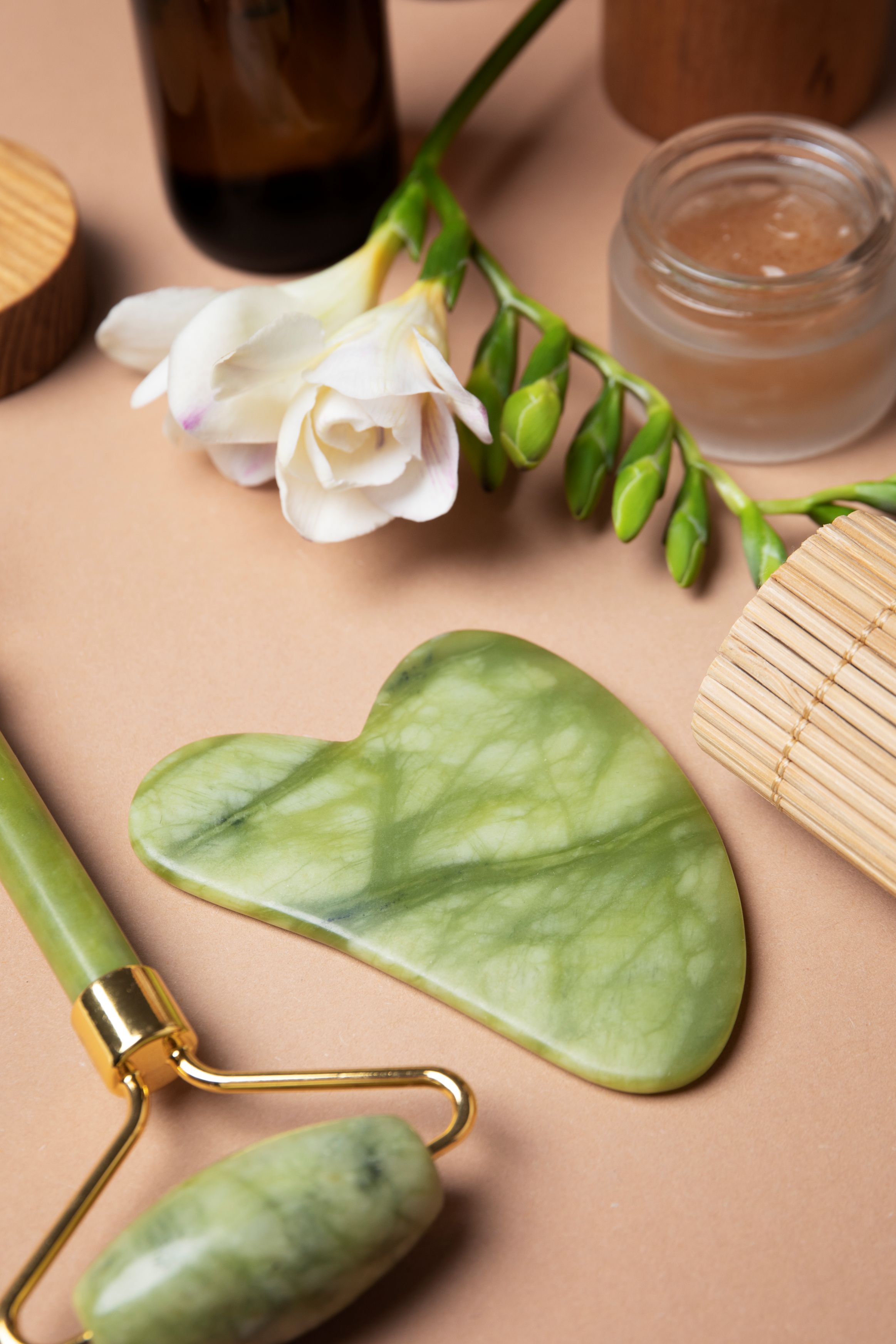 Jade tools arranged for a face massage ritual