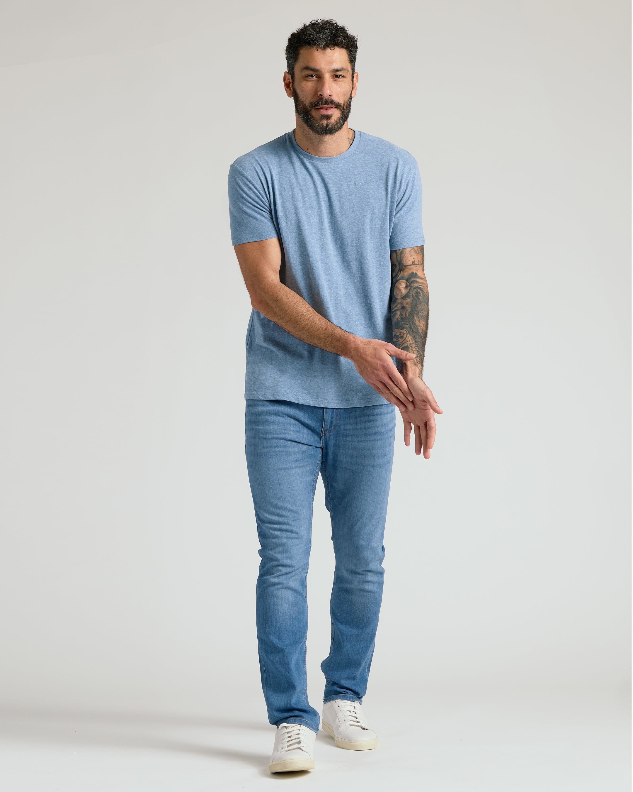 Men's straight fit high-stretch jeans in medium indigo wash - casual outfit view