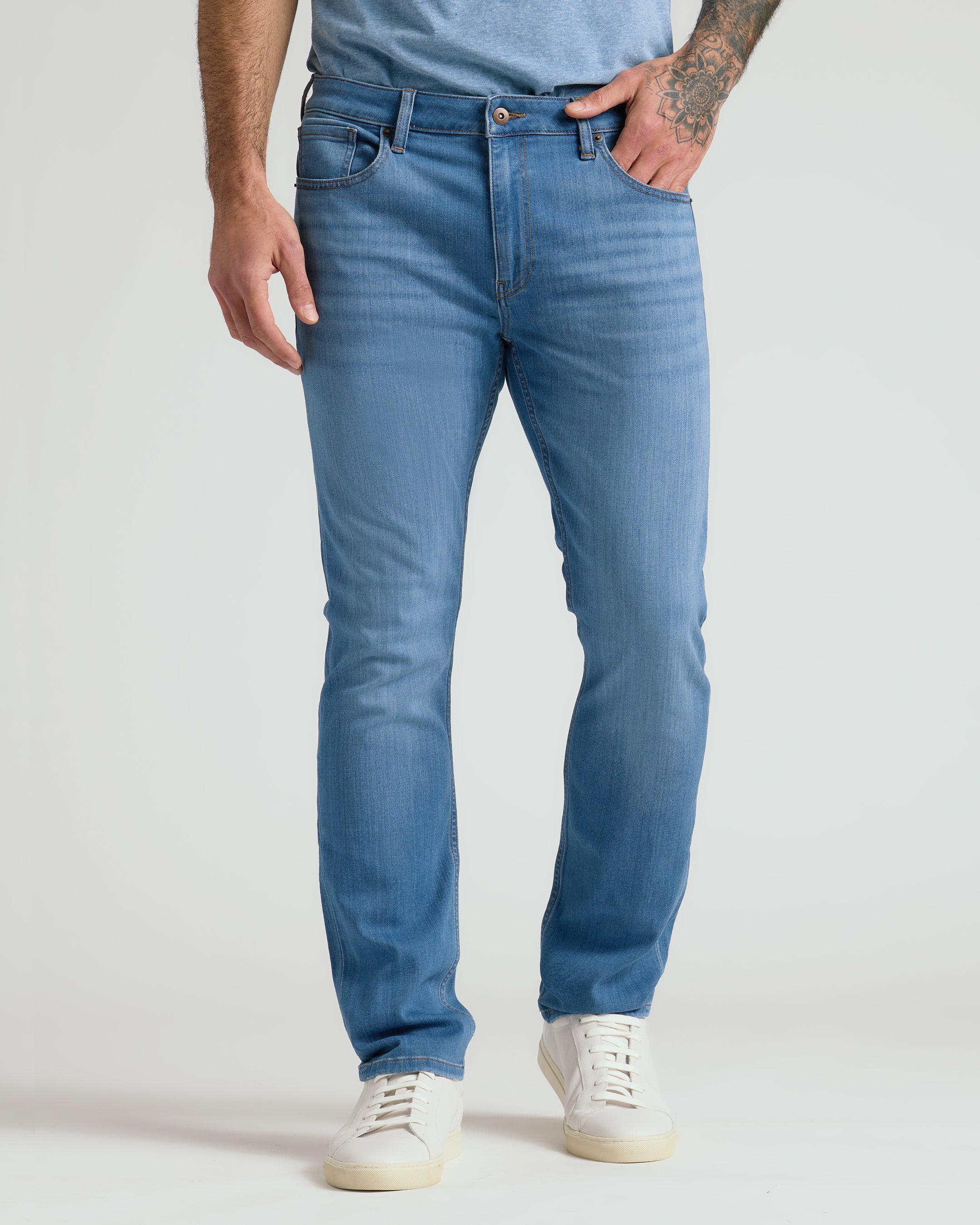Men's straight fit high-stretch jeans in medium indigo wash - full outfit front view