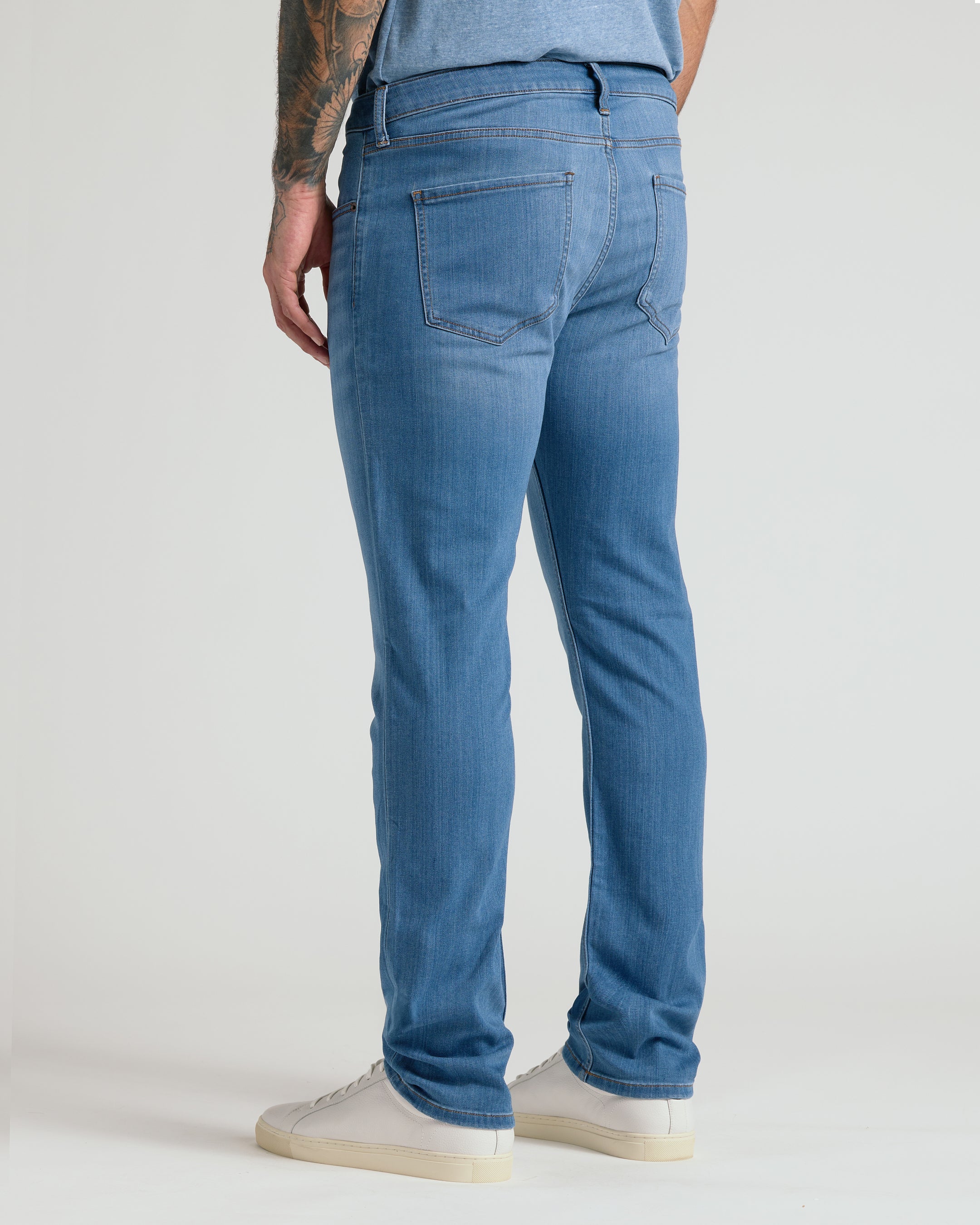 Men's straight fit high-stretch jeans in medium indigo wash - back fit view