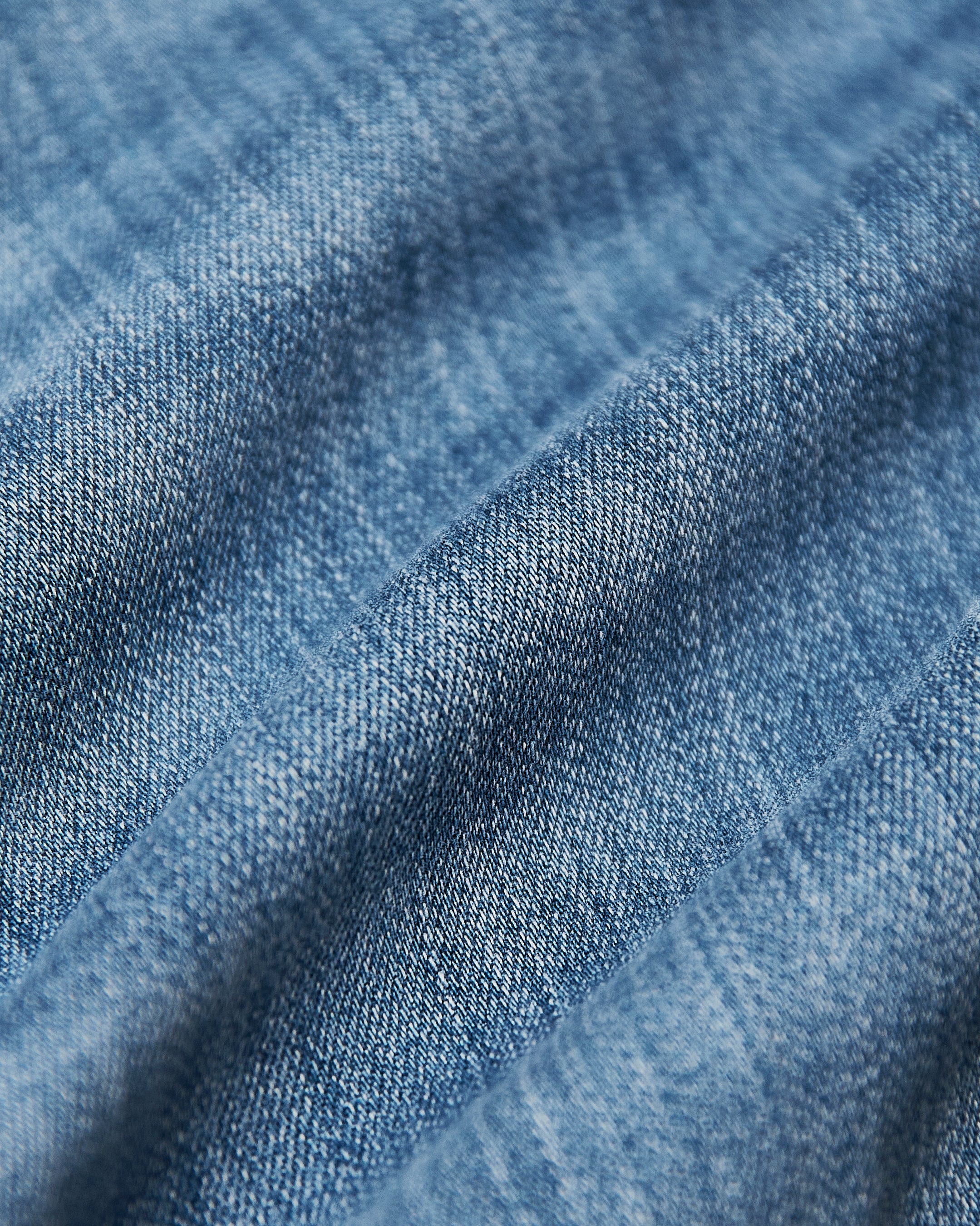 Men's straight fit high-stretch jeans in medium indigo wash - fabric close-up