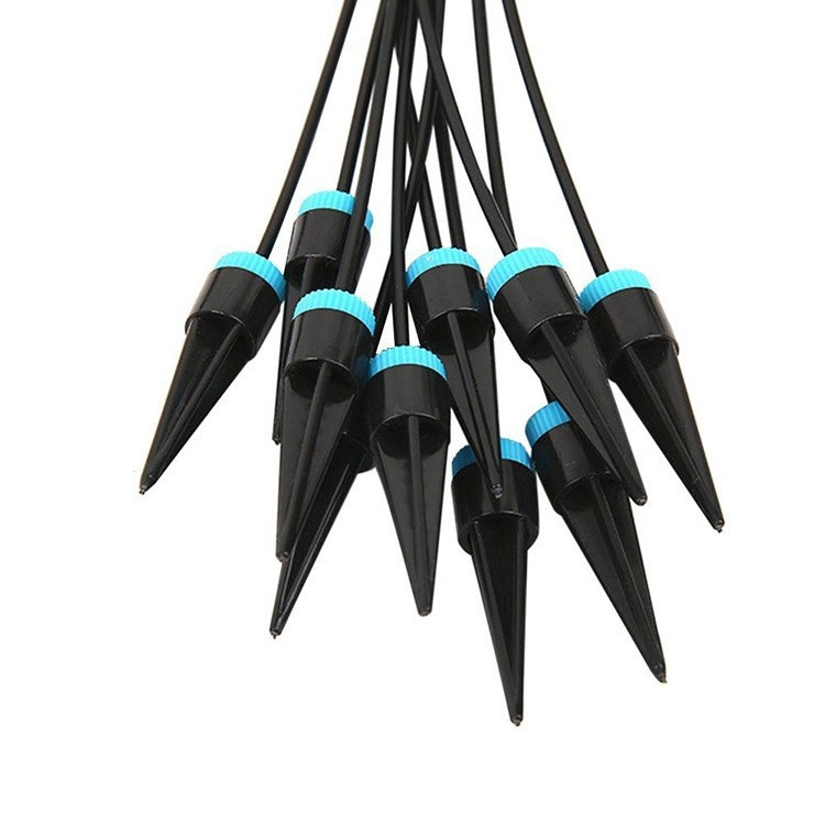 Close-up of drip kit watering succulents in pots