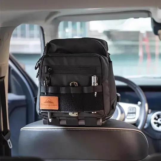 Tactical vehicle storage bag, rear seat headrest extended storage bag, suitable for camping and off-road gear storage.