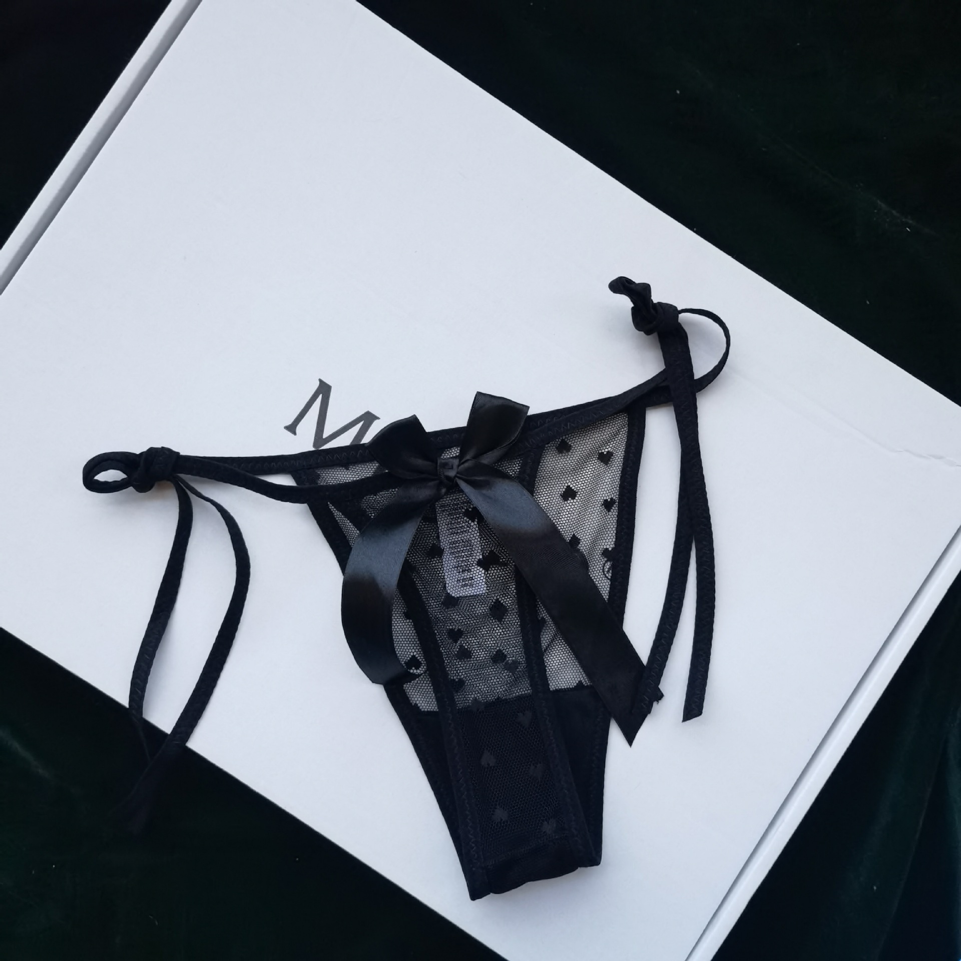 Lace-trimmed, sheer, heart-shaped, sexy thong underwear for women, with ties, in a Japanese anime style