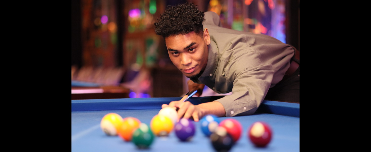 man playing pool