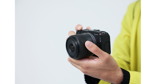 man holding camera in hand
