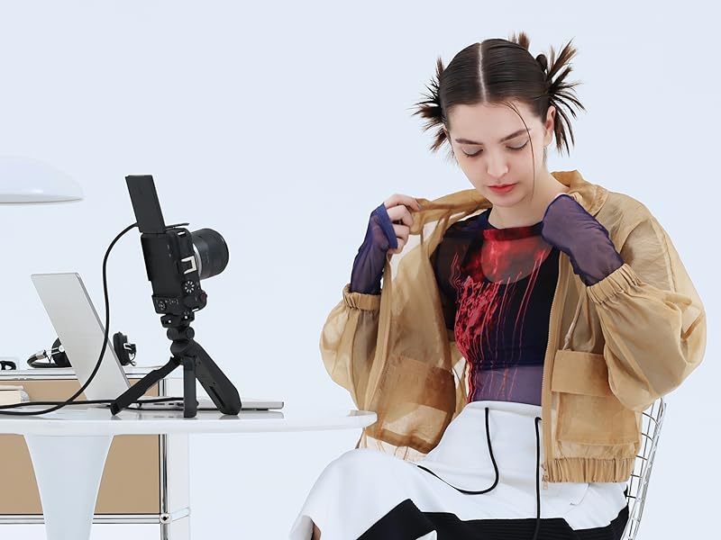 girl with camera on tripod