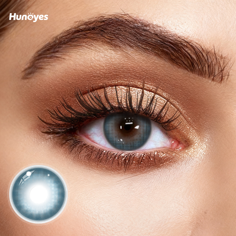 Close-up of Huneyes Mist Blue contact lens texture and design.