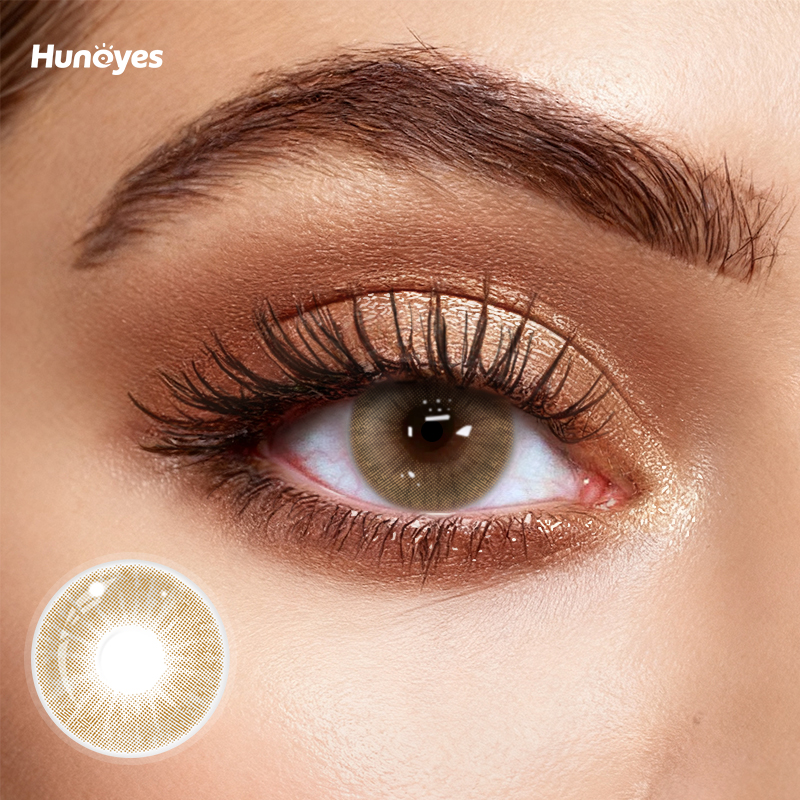 Close-up of Huneyes Whisper Brown contact lens texture and design.