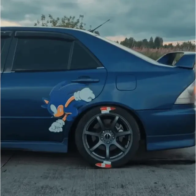 Sonic Running Along the Car Wheel in Motion