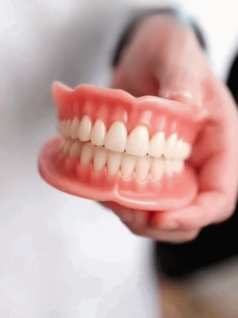 Light up your smile! Proper custom dentures for total confidence. Natural look & fit. 