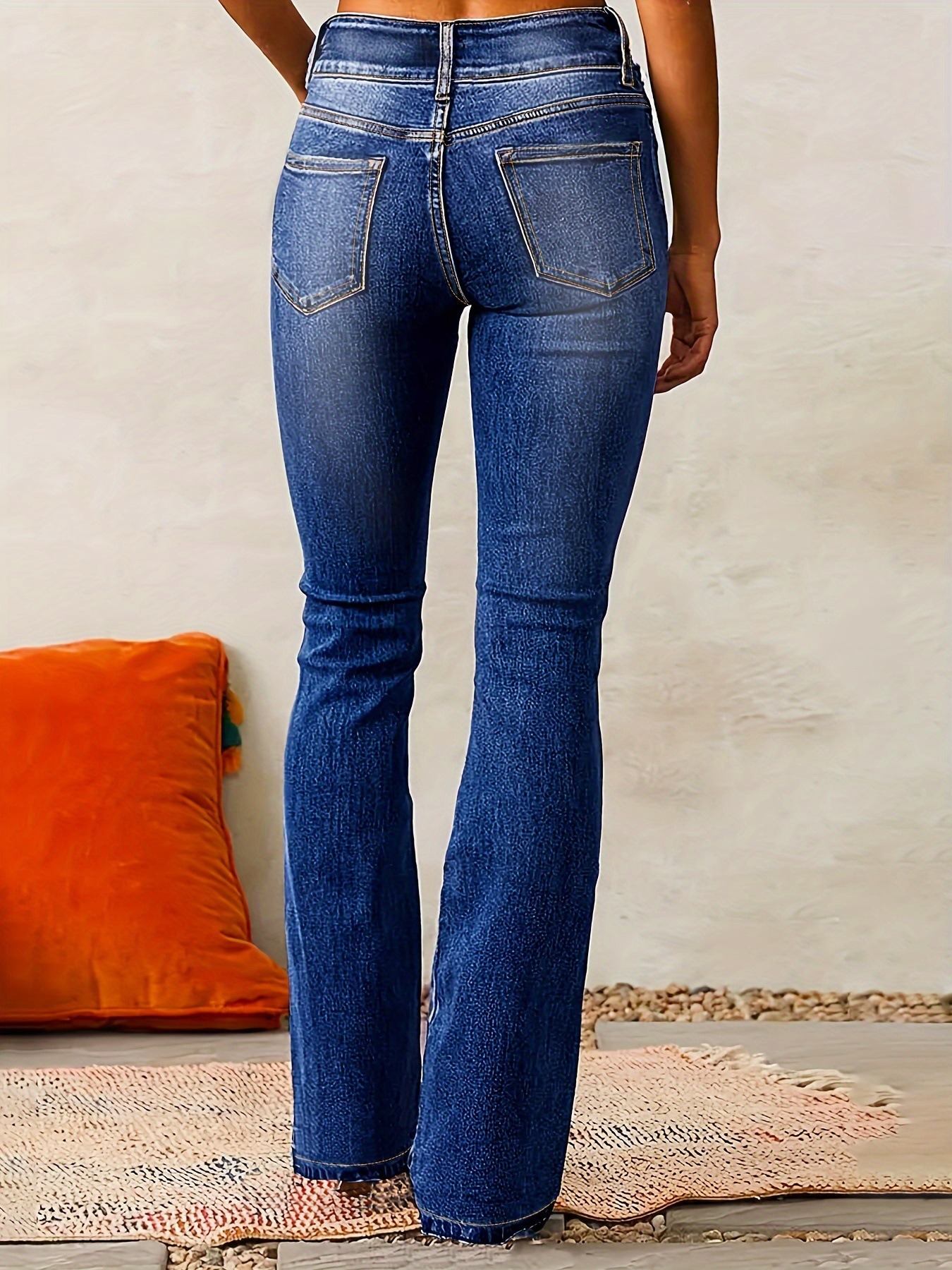 Ladies washed flared denim trousers