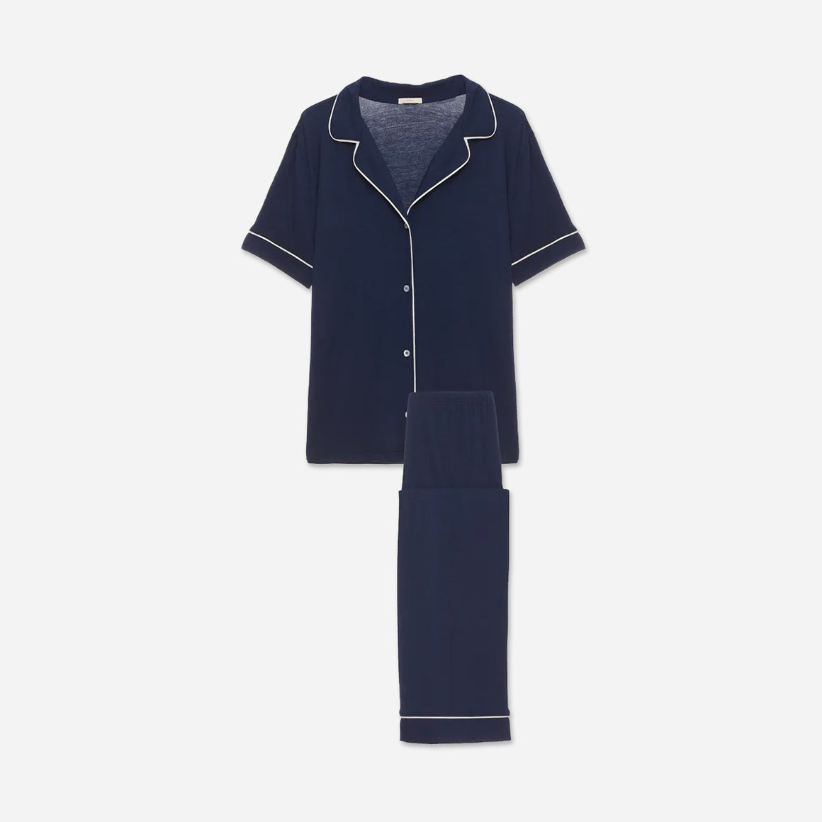 The classic yet contemporary silhouette flatters all body types, and its relaxed fit allows for unrestricted movement and maximum comfort, ensuring you wake up feeling refreshed and rejuvenated. The button-down top exudes sophistication, while the notched collar adds a touch of refinement. The matching low-rise straight leg pants offer a modern and flattering look, while the elastic waistband provides a customized fit.