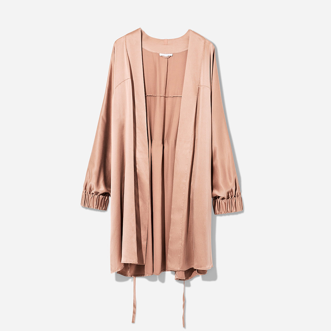 The Washable Silk Robe features a relaxed fit with a waist belt and pockets for added convenience. The lightweight and breathable fabric makes it perfect for layering over your favorite pajamas or loungewear. Machine washable.