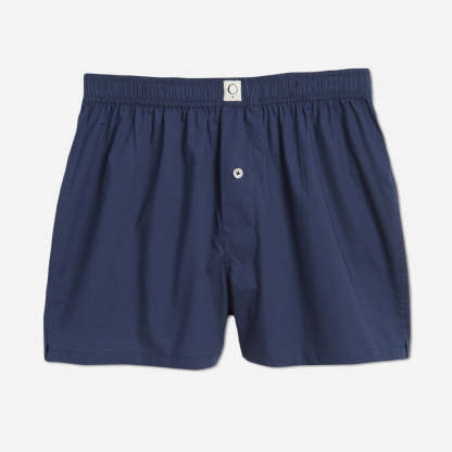 Our organic cotton boxer shorts feature a relaxed fit, button fly, and a soft elastic waistband that when folded over reveals a pop of contrast color. The lightweight fabric offers breathability and comfort for a peaceful night's sleep and a stylish look that is perfect for lounging at home.