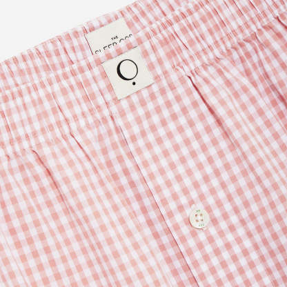 Our organic cotton boxer shorts feature a relaxed fit, button fly, and a soft elastic waistband that ensures a snug fit without being restrictive. The lightweight fabric offers breathability and comfort for a peaceful night's sleep and a stylish look that is perfect for lounging at home.