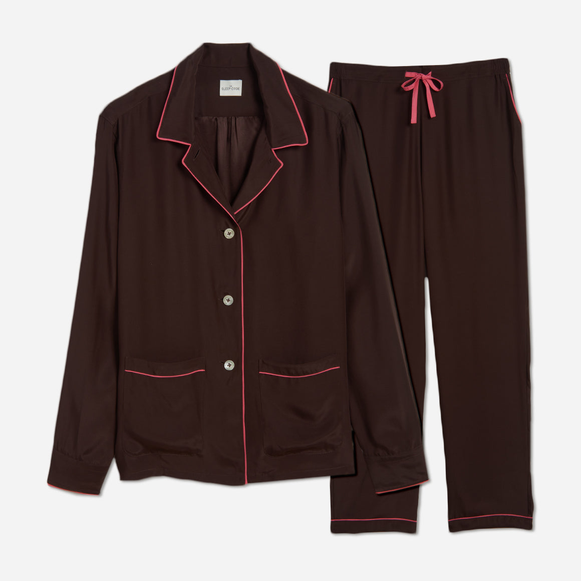 The pajama set includes a classic button-up top with a collar, two patch pockets, and functional button cuffs. The matching pair of pants features a comfortable elastic waistband, drawstring, and side-seam pockets. This cozy pj set is a timeless and stylish look that is perfect for lounging at home.