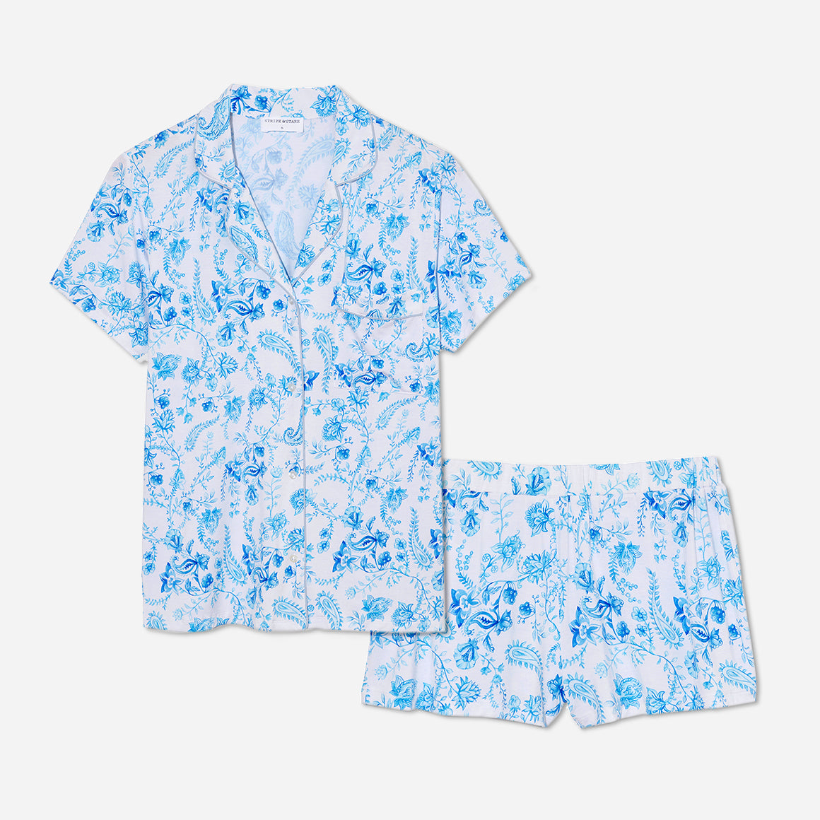 The timeless design of this short pajama set is accentuated by its tailored cut and refined detailing. The button-down front allows for easy wearing and effortless style, while the matching shorts feature an elastic waistband that provides a customized fit.