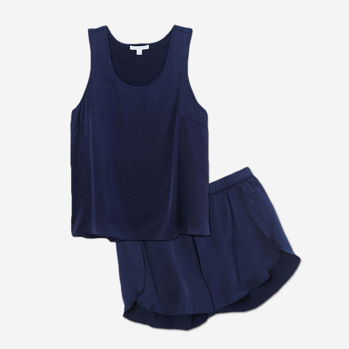 The set includes a sleeveless tee and relaxed-fit shorts, both crafted from breathable silk fabric that is lightweight, comfortable, and machine washable. The shorts feature an elastic waistband for a perfect fit, while the top is designed with a flattering neckline and relaxed fit that drapes beautifully on the body.
