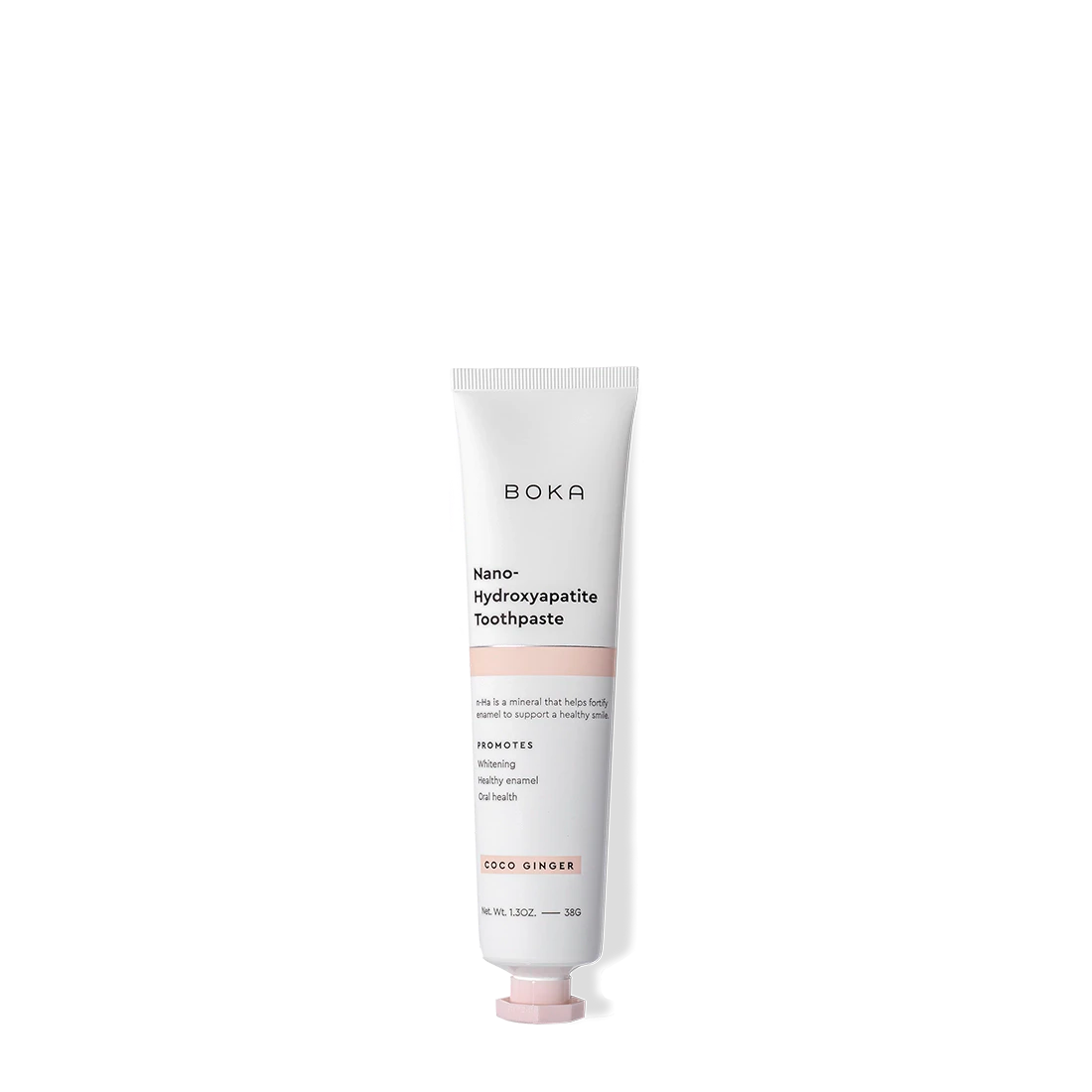 Coco Ginger Travel Size n-Ha Toothpaste helps remineralize teeth in a pink and white tube.