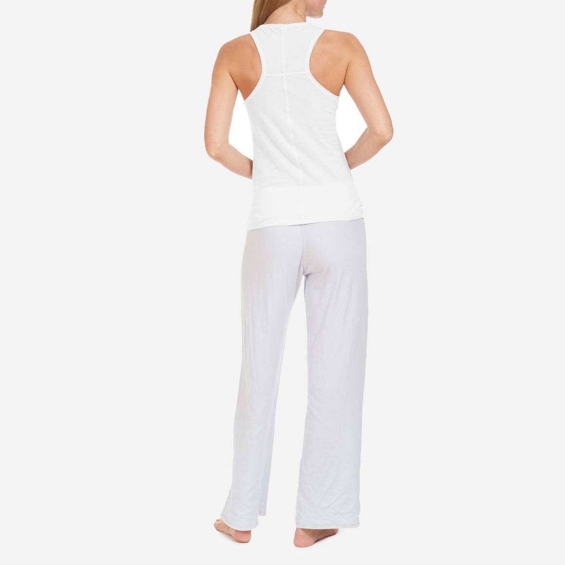 Skin’s Organic Pima Cotton Racerback Tank is the epitome of comfort and versatility. Made from the finest quality organic cotton, this lounge tank offers an unmatched level of softness and sustainability. The smooth, breathable fabric is gentle against your skin, providing a luxurious feel whether you’re lounging at home or running errands. The slim fit and timeless design of this tank top features a classic scoop neckline and alluring racerback, offering a perfect balance between style and comfort.