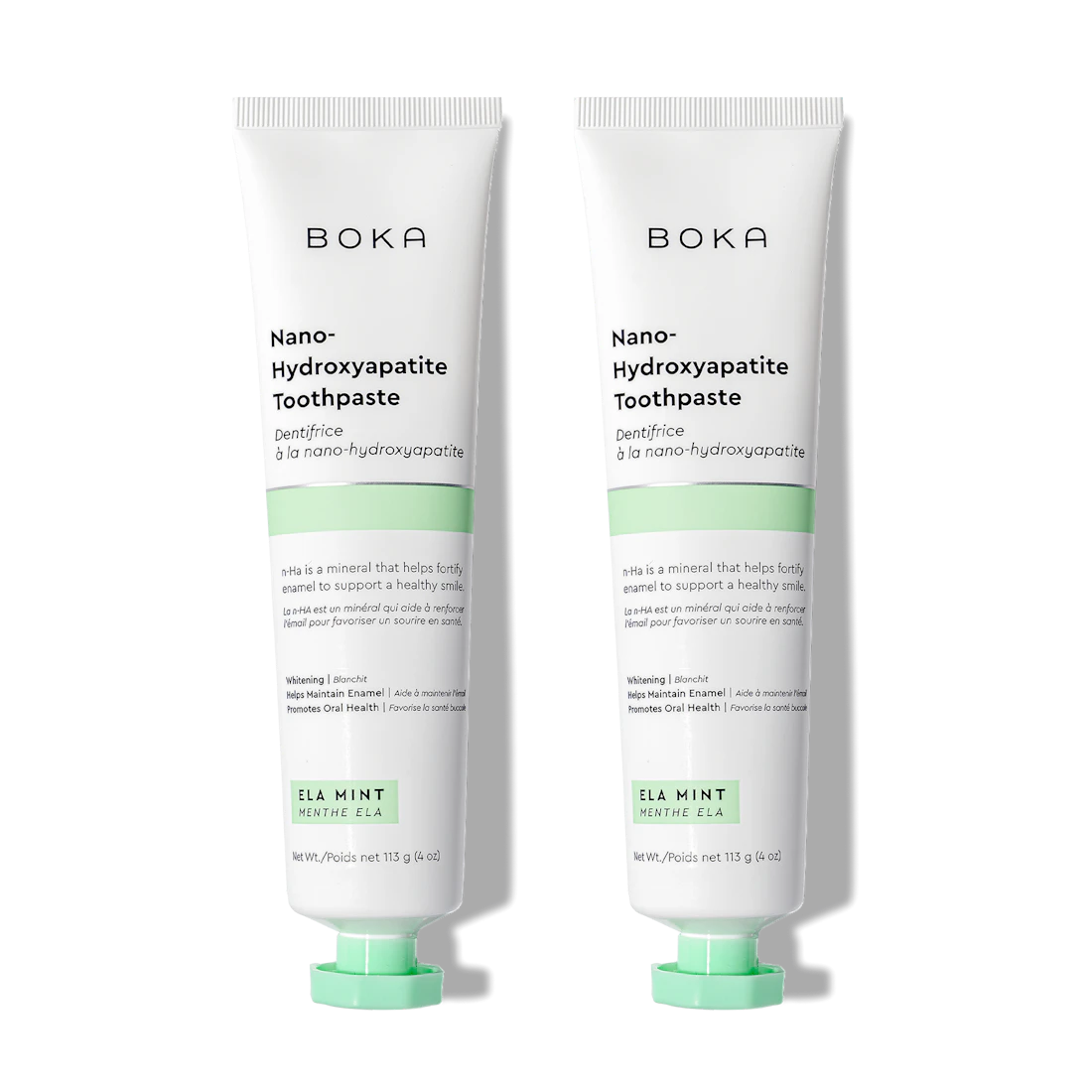 Two upright tubes of Boka Ela Mint n-Ha Toothpaste, fluoride-free with nano-hydroxyapatite.