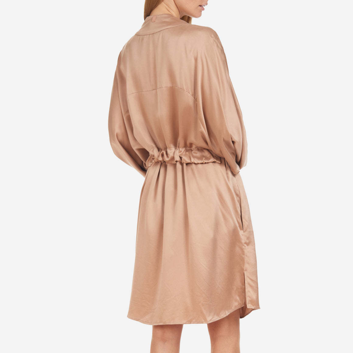 The Washable Silk Robe features a relaxed fit with a waist belt and pockets for added convenience. The lightweight and breathable fabric makes it perfect for layering over your favorite pajamas or loungewear. Machine washable.