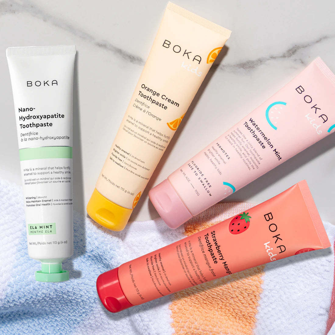 Three colorful n-Ha Toothpaste Family tubes with fun, kid-approved flavors for healthy brushing.