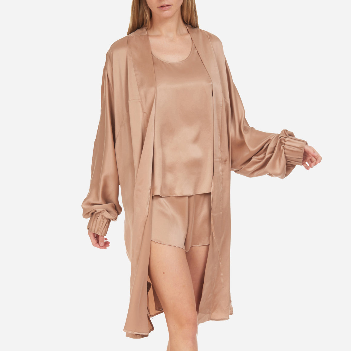 The Washable Silk Robe features a relaxed fit with a waist belt and pockets for added convenience. The lightweight and breathable fabric makes it perfect for layering over your favorite pajamas or loungewear. Machine washable.