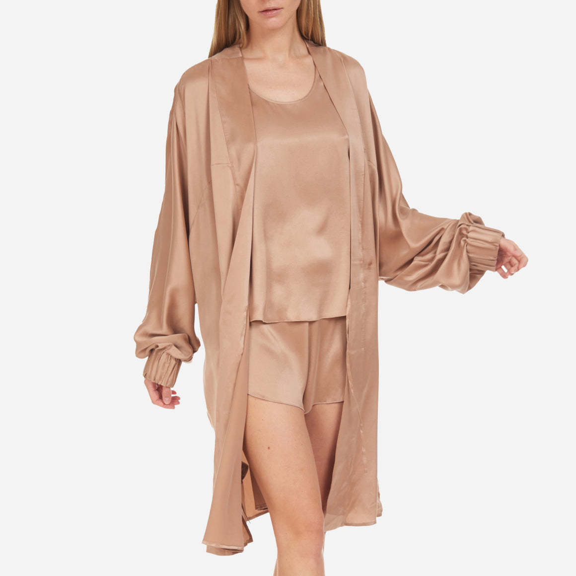 The Washable Silk Robe features a relaxed fit with a waist belt and pockets for added convenience. The lightweight and breathable fabric makes it perfect for layering over your favorite pajamas or loungewear. Machine washable.