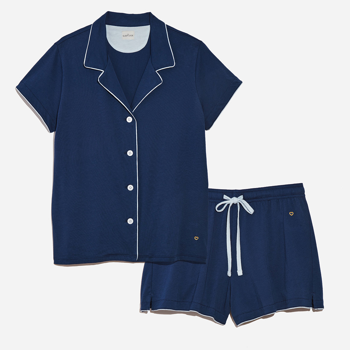 Buttery soft navy blue pajama set with white piping.