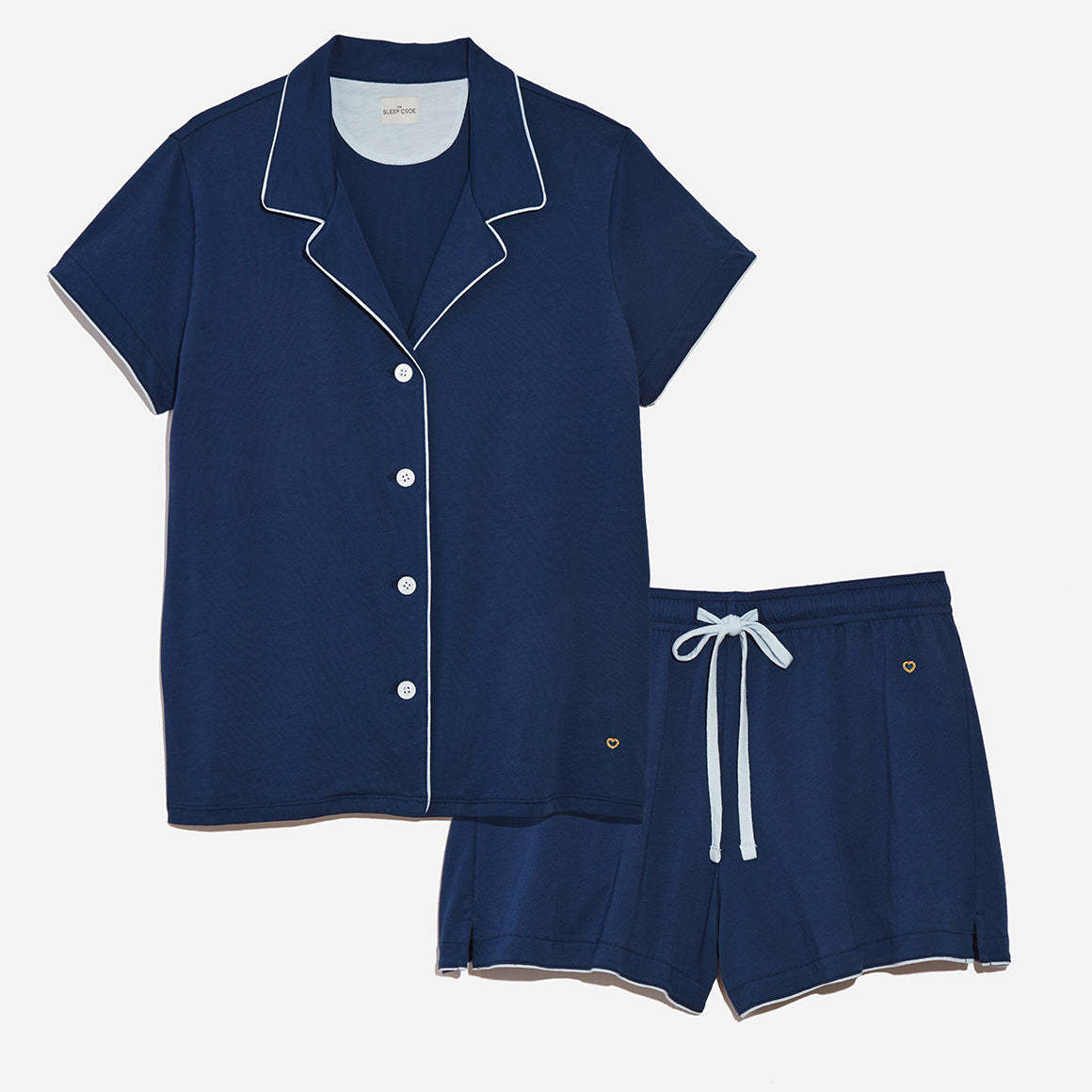Buttery soft navy blue pajama set with white piping.