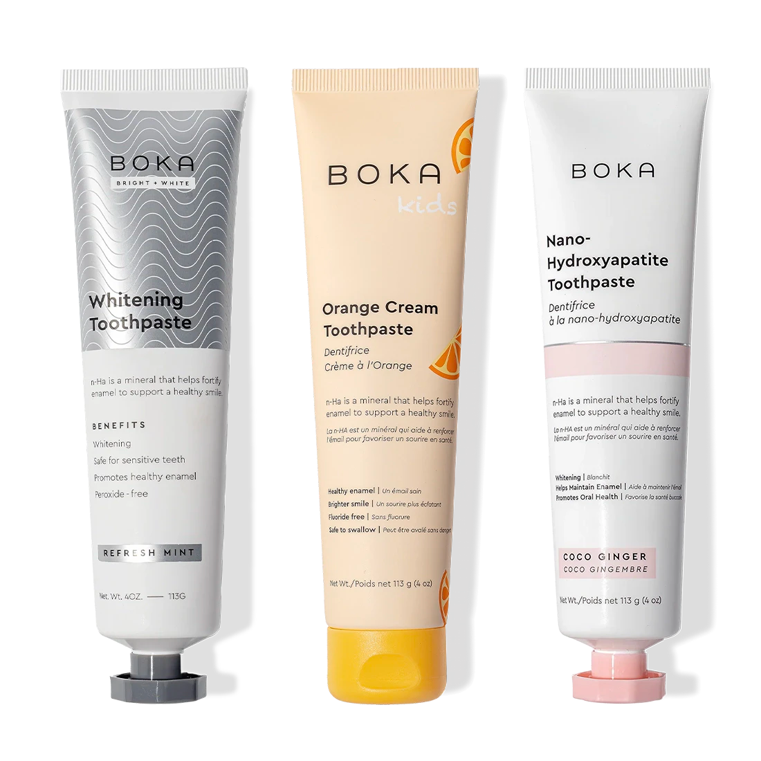 Three upright Boka Nano (n-Ha) Whitening 3 Pack toothpastes: Whitening and Orange Cream.