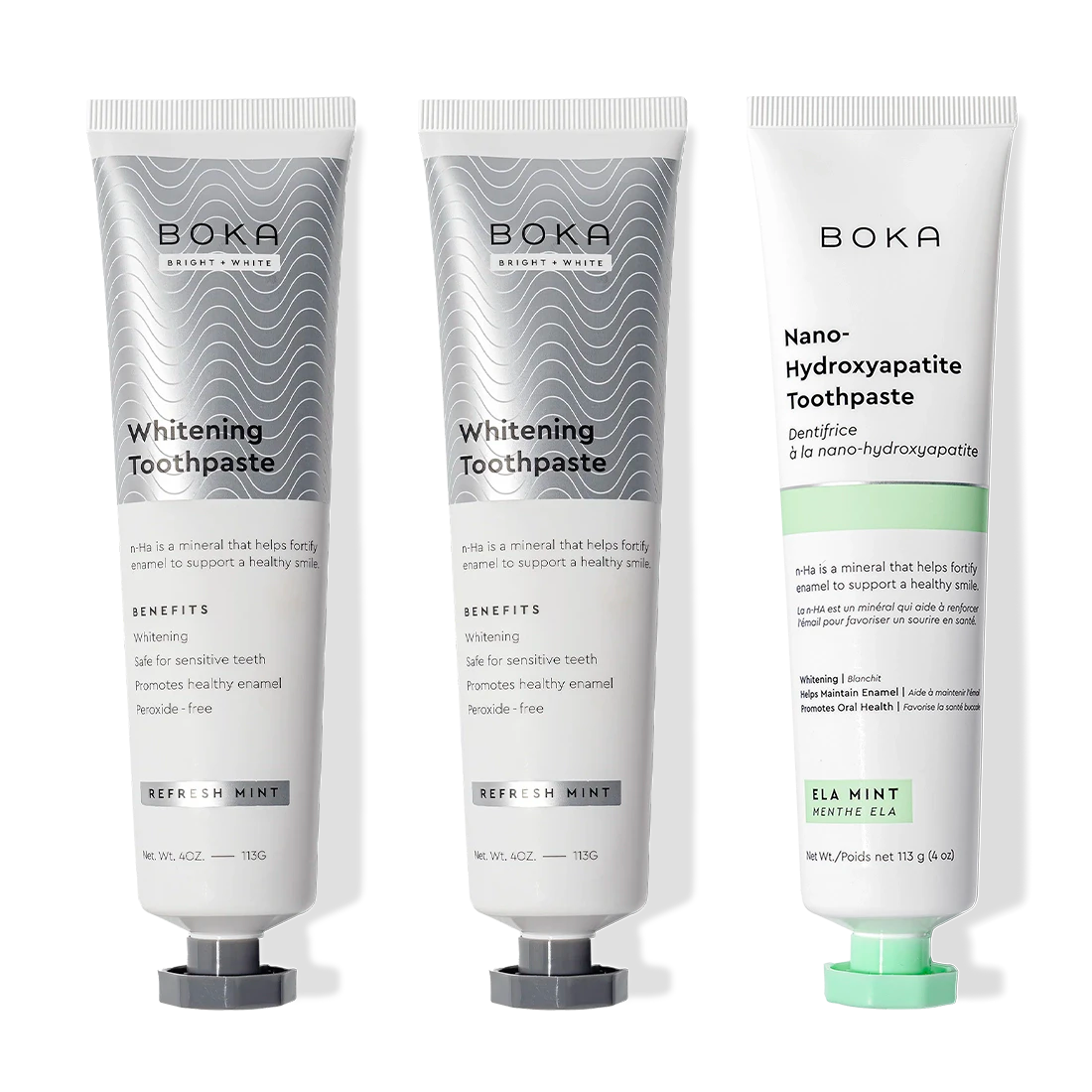 Gallery view - Three upright Nano (n-Ha) Toothpaste Whitening 3 Pack tubes: two silver, one white and green.