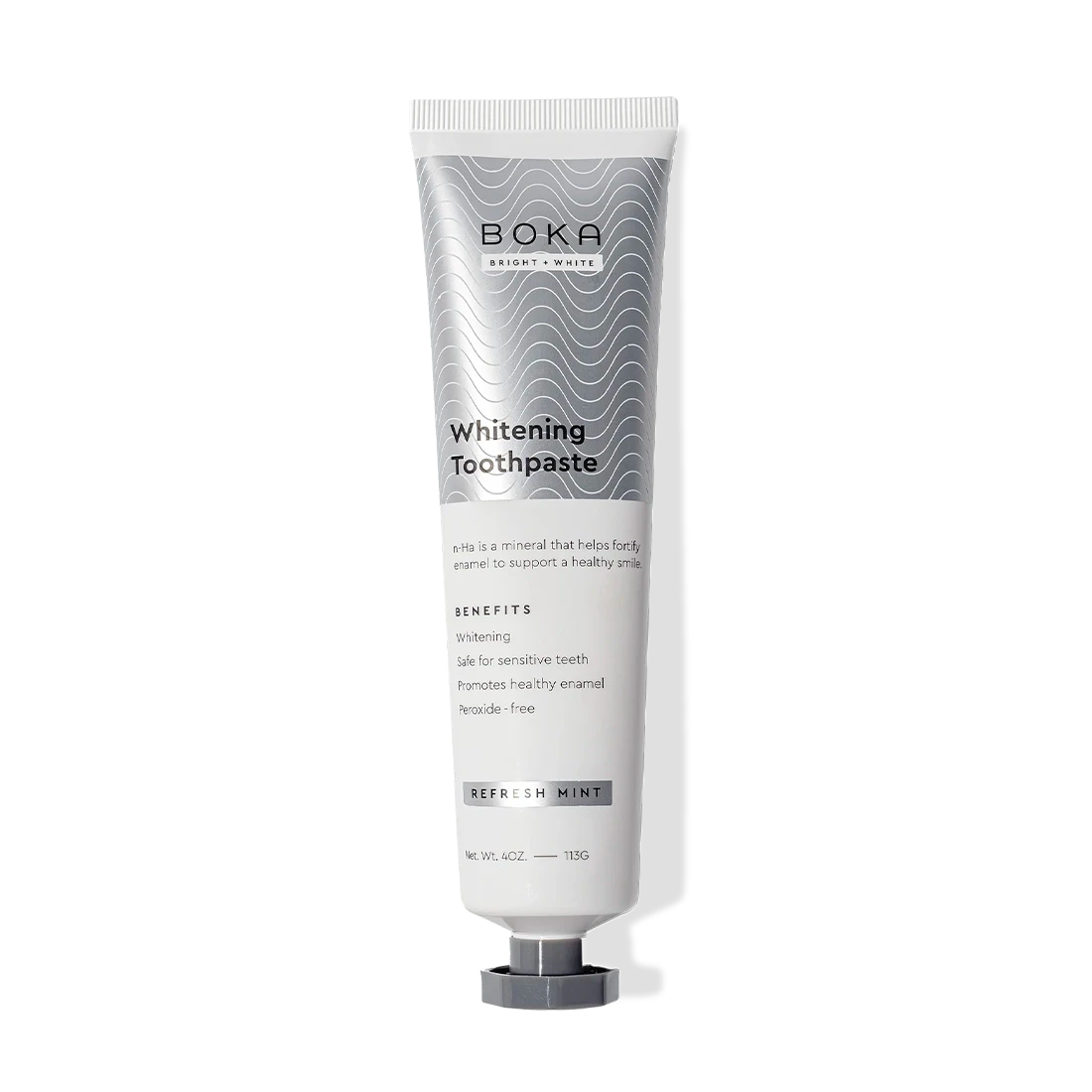 Gallery view - A tube of Refresh Mint Whitening n-Ha Toothpaste for sensitive teeth, upright on white background.