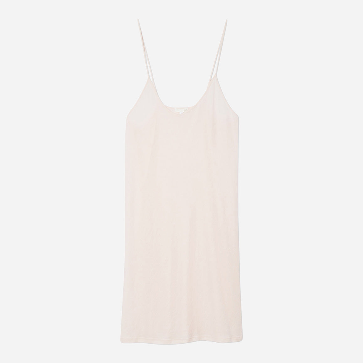 This slip features a v-neckline that accentuates your curves, creating a stunning silhouette that is both elegant and alluring. Crafted with meticulous attention to detail, this above the knee slip is made from luxurious organic pima cotton jersey which feels soft and gentle against your skin. The delicate straps add a stylish touch, while the flattering drape of the fabric will make this a favorite of your nighttime routine.