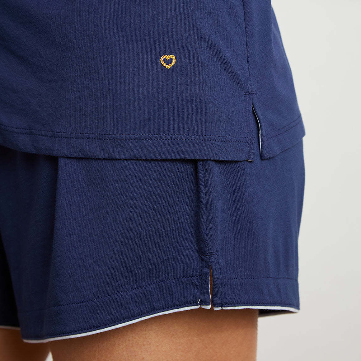 Buttery soft navy blue pajama set with white piping.