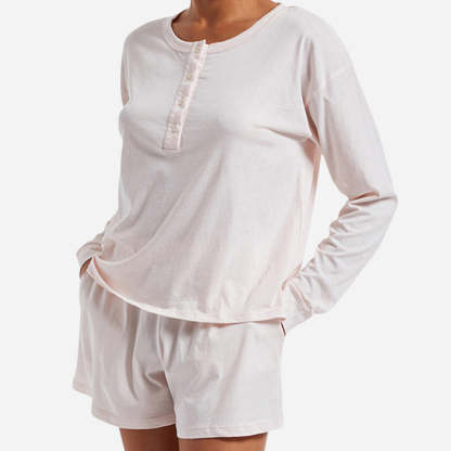 The design of the Chloe PJ Set is as elegant as it is versatile. The classic long sleeve henley shirt features a relaxed fit and a flattering neckline. The cozy shorts offer a comfortable, yet flattering silhouette, with side seam pockets and an elastic waistband ensuring a personalized fit for all body types.