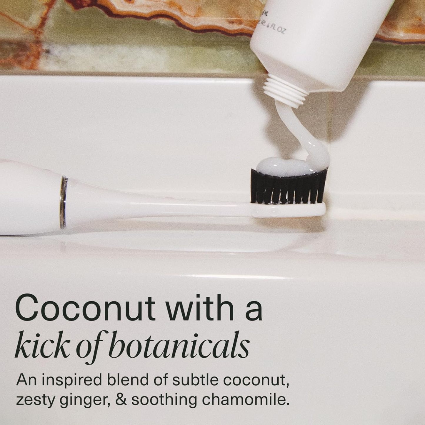 Coco Ginger n-Ha Toothpaste with nano-hydroxyapatite being squeezed onto a toothbrush.